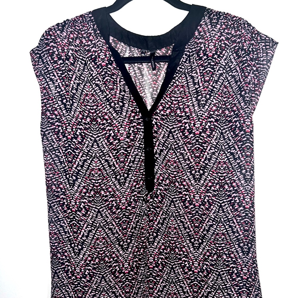 Black and pink loose fitting sheer top.